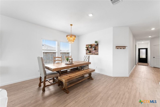 5903 Geronimo Vis, Seguin, TX 78155 - dining area featuring light wood finished floors, a chandelier, baseboards, and recessed lighting