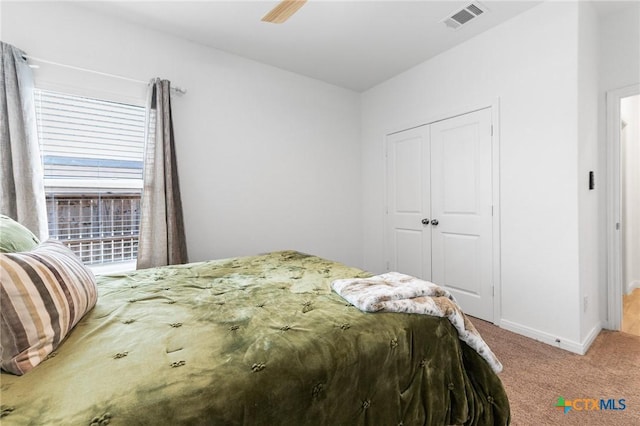 5903 Geronimo Vis, Seguin, TX 78155 - bedroom featuring light carpet, a closet, baseboards, and ceiling fan