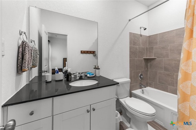 5903 Geronimo Vis, Seguin, TX 78155 - bathroom featuring toilet, vanity, and shower / bathtub combination with curtain