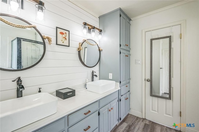 1811 Rally Ln, Harker Heights, TX 76548 - full bathroom with wood finished floors, ornamental molding, and double vanity