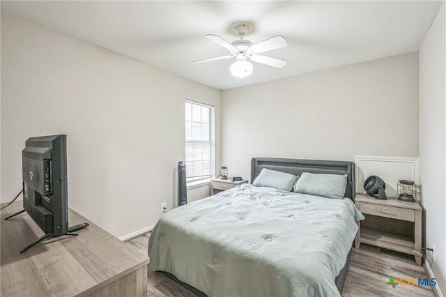 1811 Rally Ln, Harker Heights, TX 76548 - bedroom with wood finished floors, baseboards, and a ceiling fan