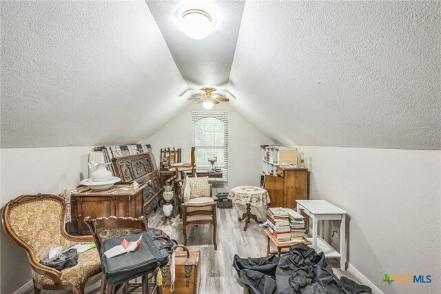1811 Rally Ln, Harker Heights, TX 76548 - living area with a textured ceiling, wood finished floors, ceiling fan, baseboards, and vaulted ceiling