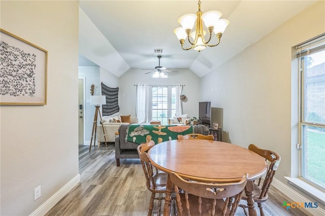 1811 Rally Ln, Harker Heights, TX 76548 - dining room with light wood-style flooring, a chandelier, healthy amount of natural light, and lofted ceiling