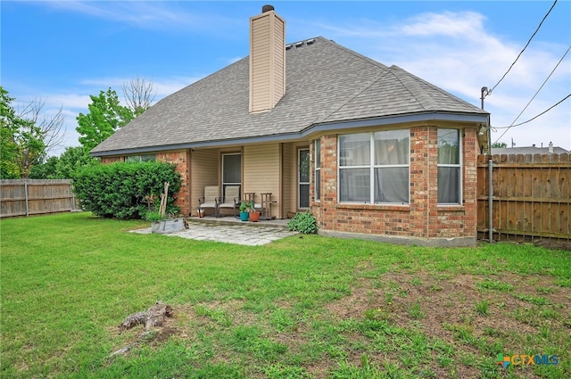 1811 Rally Ln, Harker Heights, TX 76548 - rear view of house with a patio area, brick siding, roof with shingles, and a chimney