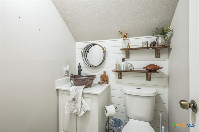 1811 Rally Ln, Harker Heights, TX 76548 - bathroom featuring a textured ceiling, vanity, and toilet