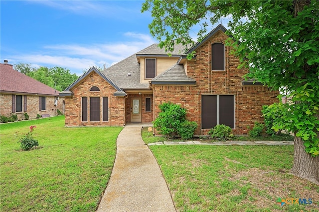 1811 Rally Ln, Harker Heights, TX 76548 - traditional-style home with roof with shingles, a front lawn, and brick siding