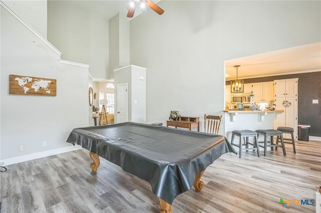 1811 Rally Ln, Harker Heights, TX 76548 - rec room with light wood-style flooring, a high ceiling, a ceiling fan, billiards, and baseboards