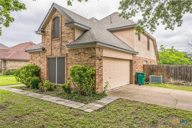 1811 Rally Ln, Harker Heights, TX 76548 - view of home's exterior featuring brick siding, central AC unit, driveway, and a shingled roof