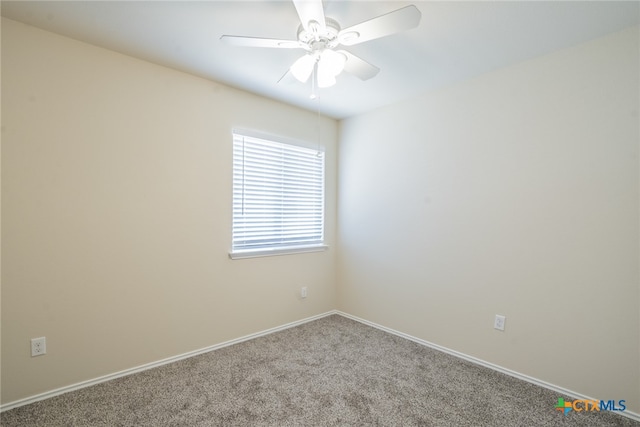 empty room featuring carpet flooring and ceiling fan