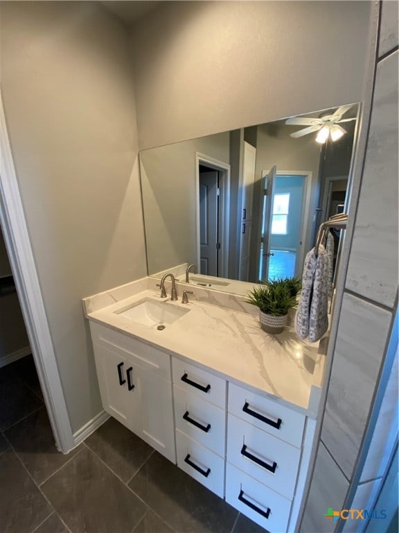 bathroom featuring vanity, ceiling fan, and tile patterned floors