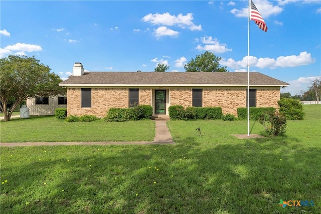 296 Valiant Wills Rd, Bruceville-Eddy, TX 76630 - ranch-style house featuring a front yard, brick siding, a chimney, and a shingled roof
