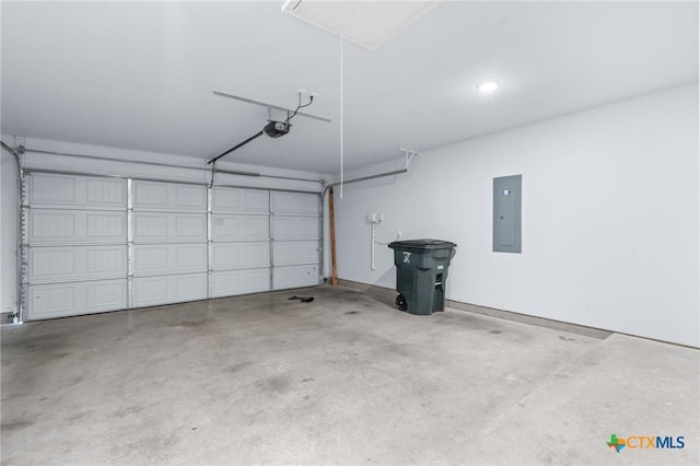 garage featuring a garage door opener and electric panel