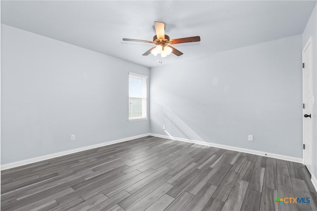 unfurnished room with dark hardwood / wood-style floors and ceiling fan