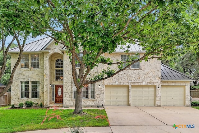 12604 Duckcreek Ct, Austin, TX 78729 - view of front of house featuring a standing seam roof, metal roof, and stone siding