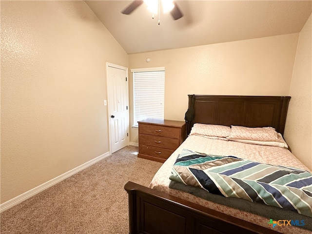 bedroom with ceiling fan, light colored carpet, and vaulted ceiling