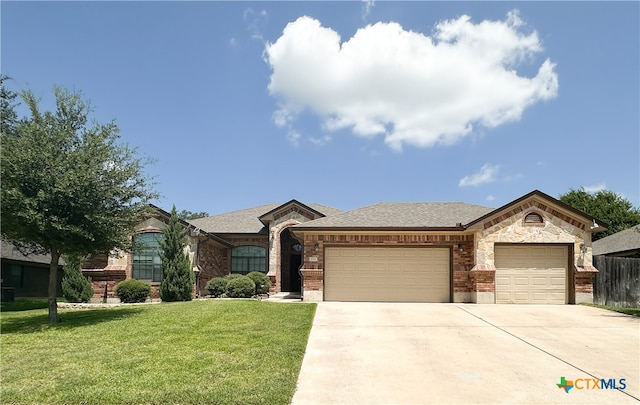 ranch-style home featuring a front lawn and a garage