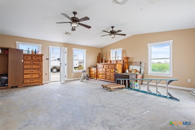 misc room featuring lofted ceiling, concrete floors, and ceiling fan