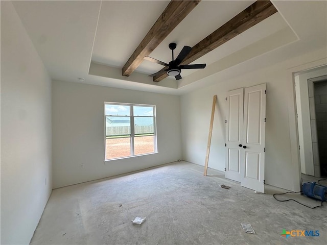 unfurnished bedroom featuring beamed ceiling and a ceiling fan