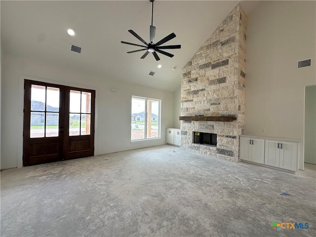 unfurnished living room with a ceiling fan, high vaulted ceiling, visible vents, and french doors