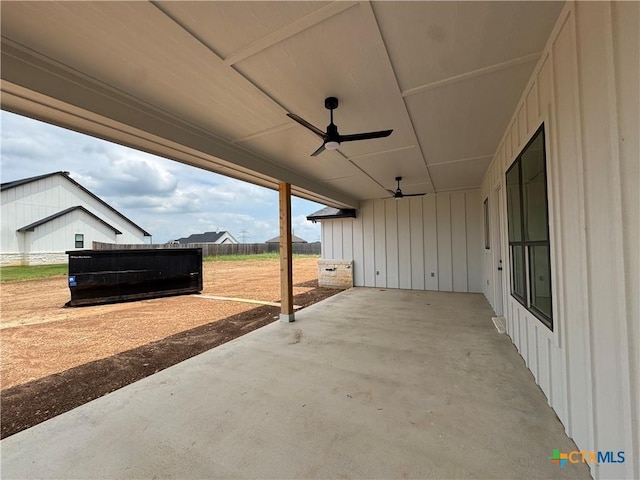 view of patio with a ceiling fan and fence