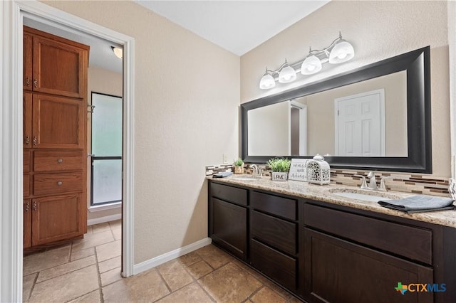 bathroom with vanity and backsplash