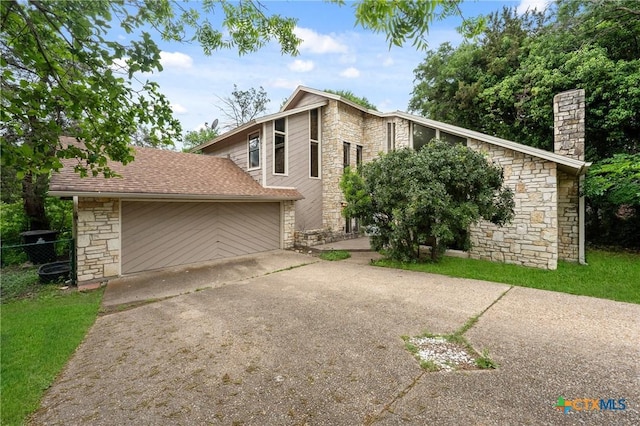 view of side of home with a garage