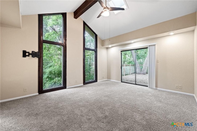 carpeted empty room with beamed ceiling, ceiling fan, and high vaulted ceiling