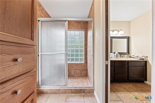 bathroom featuring vanity and walk in shower