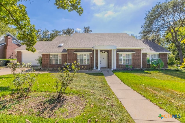 ranch-style home with a front lawn