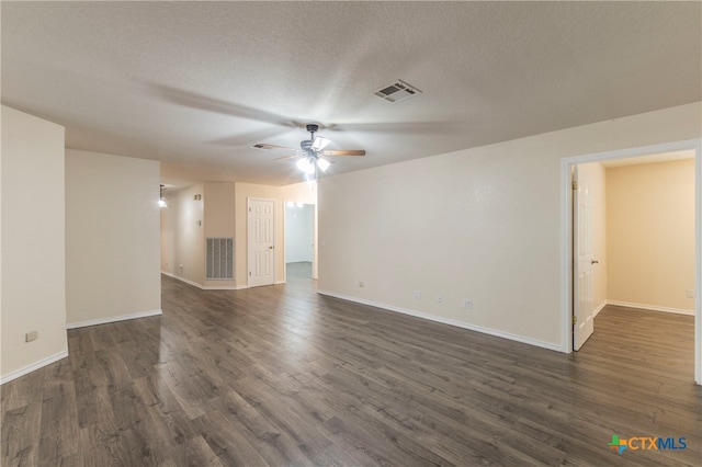 unfurnished living room featuring dark hardwood / wood-style flooring, a textured ceiling, and ceiling fan