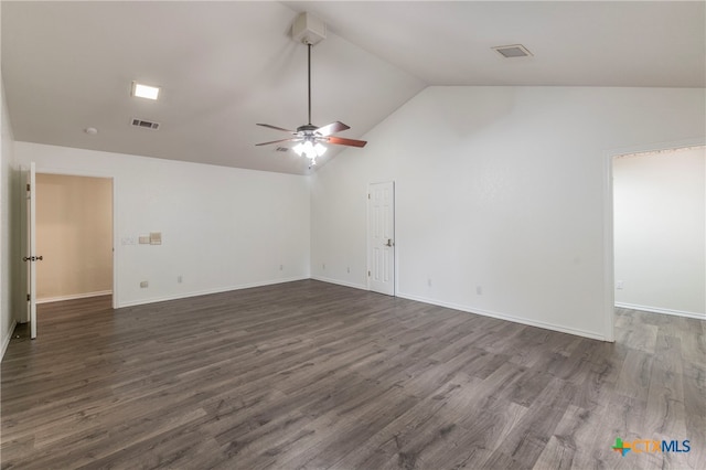 empty room featuring ceiling fan, lofted ceiling, and dark hardwood / wood-style floors