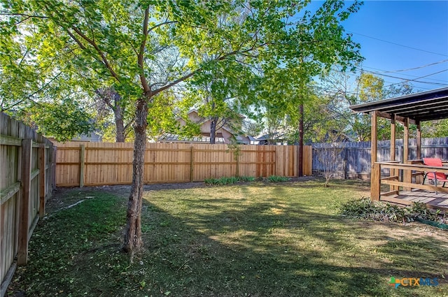 view of yard with a wooden deck