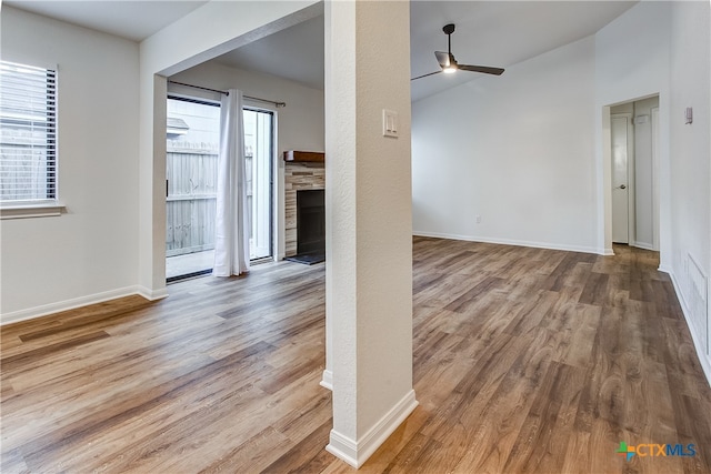 unfurnished living room with hardwood / wood-style flooring and ceiling fan