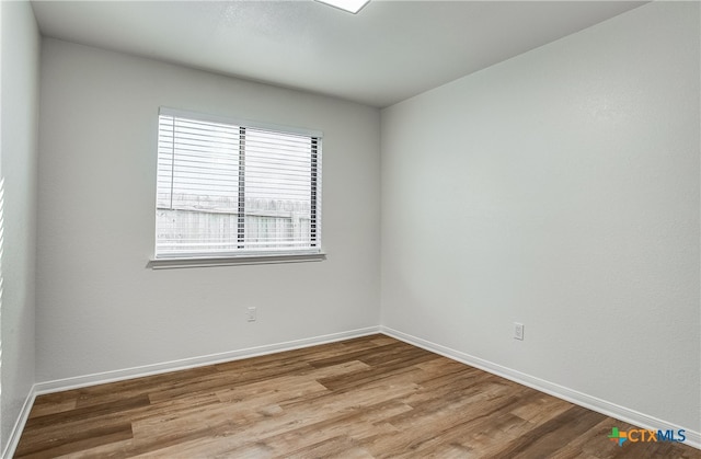 unfurnished room featuring light wood-type flooring