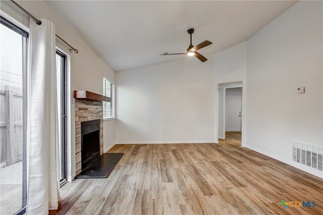 unfurnished living room with light hardwood / wood-style flooring, lofted ceiling, and ceiling fan