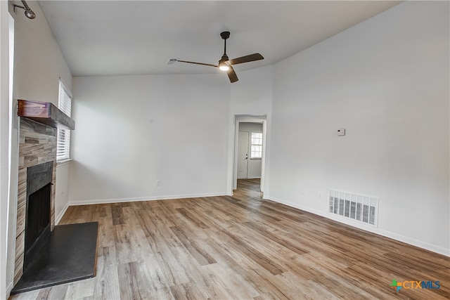 unfurnished living room featuring light wood-type flooring, ceiling fan, and high vaulted ceiling