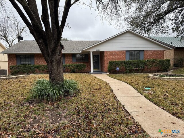 view of yard featuring a storage shed and a patio area