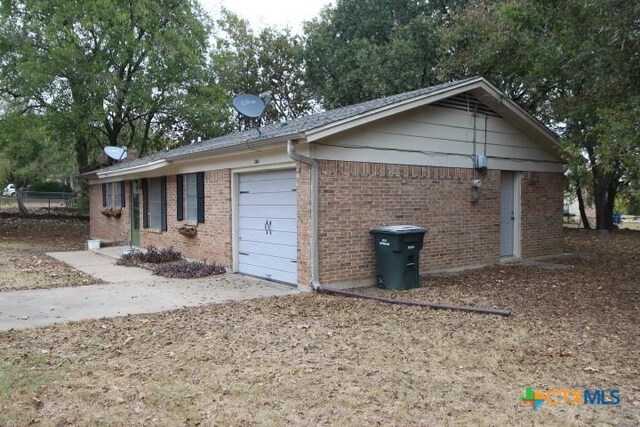 view of property exterior featuring a garage