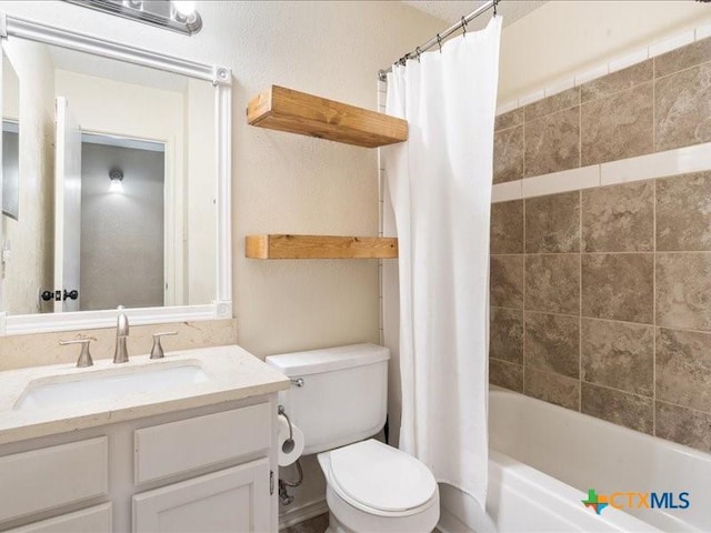 full bathroom featuring vanity, toilet, and shower / bath combo with shower curtain