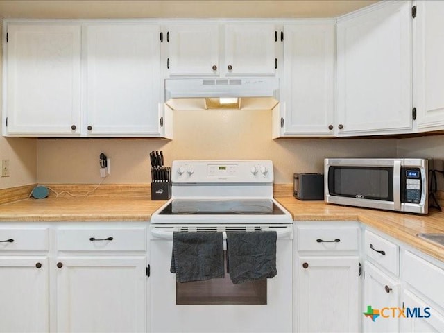 kitchen with white cabinetry and white range with electric cooktop