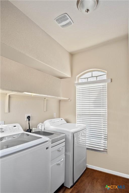 5310 Dauphin Dr, Belton, TX 76513 - laundry area with baseboards, separate washer and dryer, visible vents, and laundry area