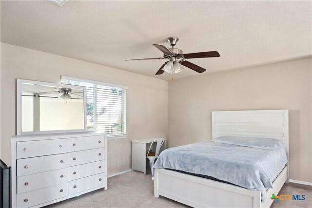 5310 Dauphin Dr, Belton, TX 76513 - bedroom featuring light carpet, baseboards, and a ceiling fan