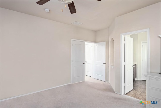 5310 Dauphin Dr, Belton, TX 76513 - unfurnished bedroom featuring a ceiling fan, baseboards, and light colored carpet