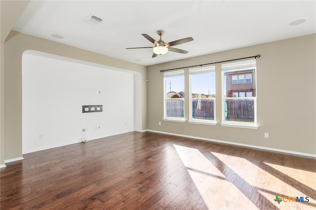 spare room with ceiling fan and carpet