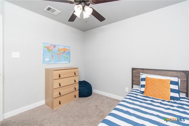 bedroom featuring baseboards, visible vents, carpet floors, and ceiling fan