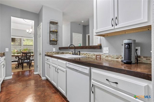 109 Dolly St, San Marcos, TX 78666 - kitchen with white dishwasher, dark countertops, concrete floors, and white cabinetry