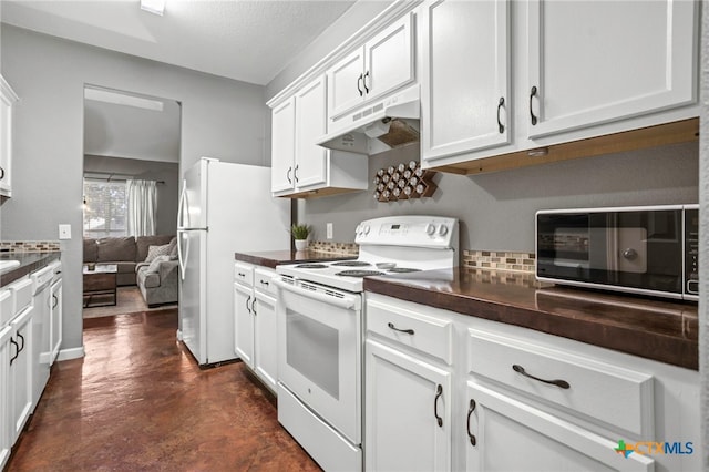 109 Dolly St, San Marcos, TX 78666 - kitchen with white appliances, under cabinet range hood, dark countertops, and concrete flooring