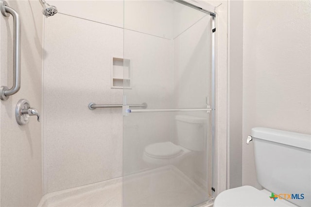 2209 Winchester Dr, Temple, TX 76502 - bathroom featuring toilet and a shower stall