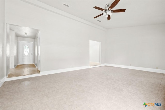 2209 Winchester Dr, Temple, TX 76502 - empty room with ceiling fan and light tile patterned floors