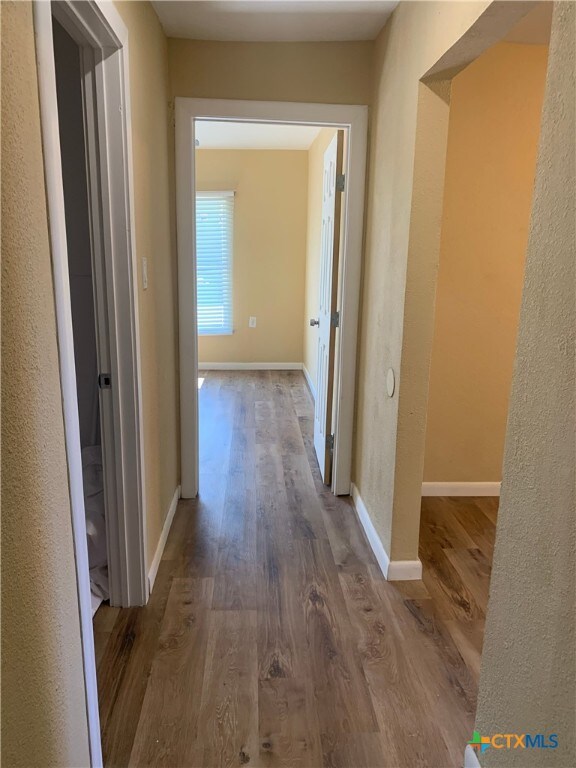 hallway featuring hardwood / wood-style floors